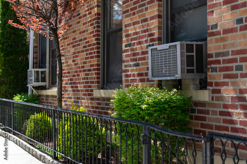 Canvas Print Outdoor Window Air Conditioning Units on an Old Brick New York City Apartment Bu