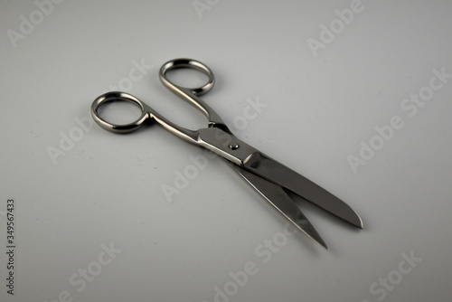 Metal scissors on white background © Maurizio