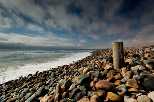 long exposure image of rocks,sea, clouds