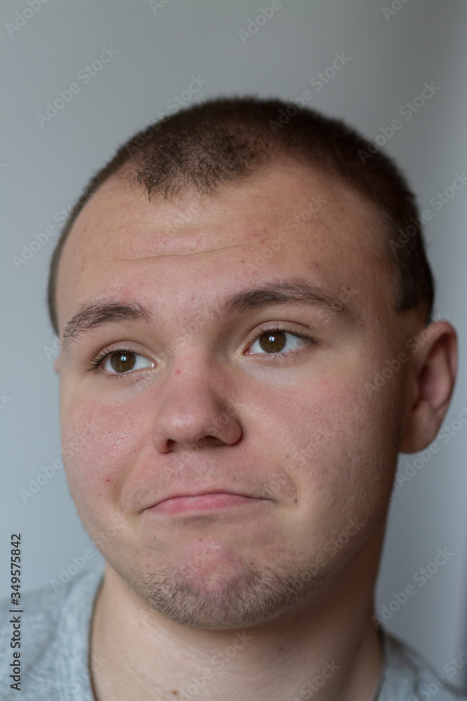 Emotions. The teenager expresses disbelief, doubt on his face. Emotions. The teenager expresses disbelief, doubt on his face.