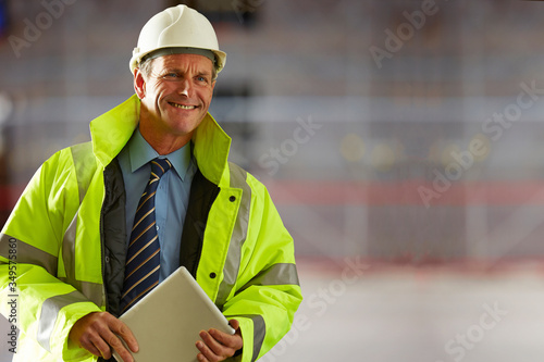 Successful mature male architect with a digital tablet