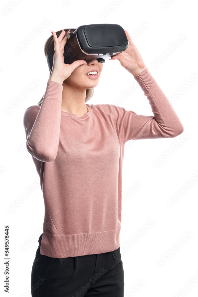 Young woman in virtual reality (VR) glasses. Isolated on white background Young woman in virtual reality (VR) glasses. Isolated on white background