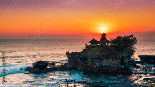 Fototapeta Naklejka Na Ścianę i Meble -  Breathtaking aerial view of of Tanah Lot Temple. Tanah Lot is a rock formation off the Indonesian island of Bali. It's home to the pilgrimage temple Pura Tanah Lot, a popular tourist and cultural icon
