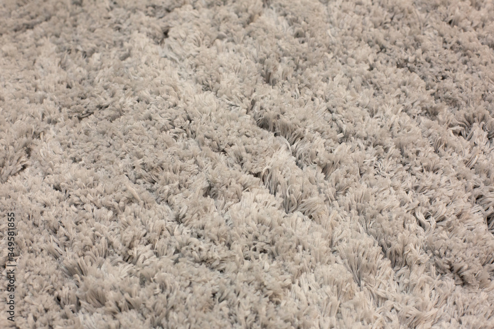 Handmade fluffy carpet texture, closeup. Wallpaper. 