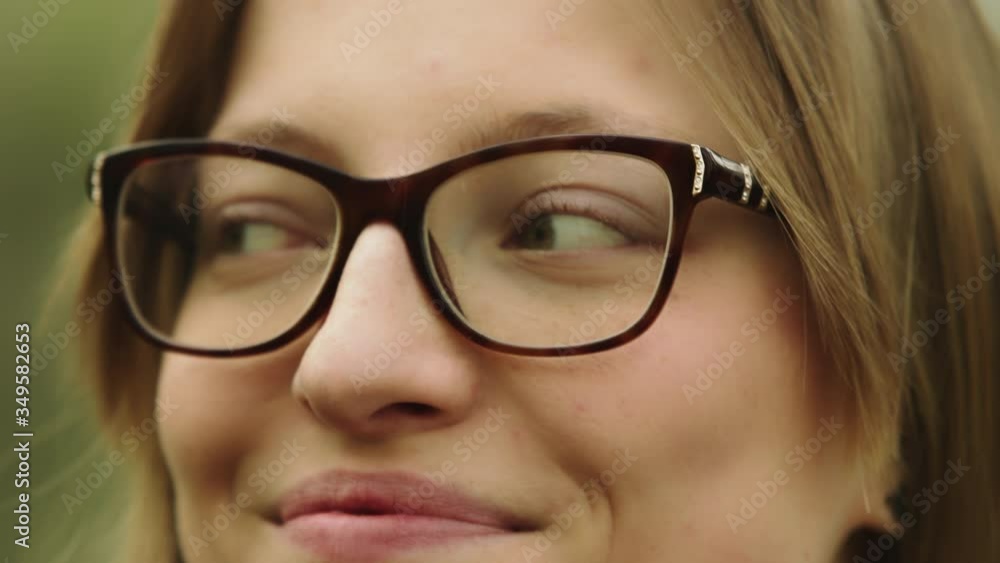 Young caucasian woman with glasses. Hapy face expression. Girl noding her head. Young caucasian woman with glasses. Hapy face expression. Girl noding her head.