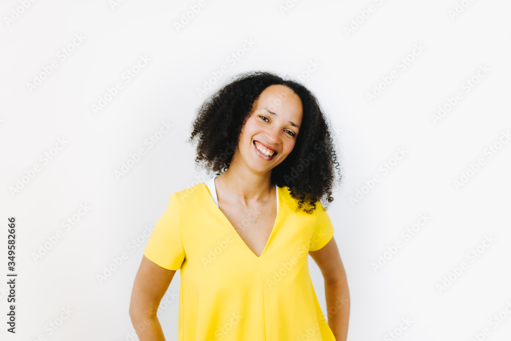 Portrait of cheerful black woman in yellow shirt Portrait of cheerful black woman in yellow shirt