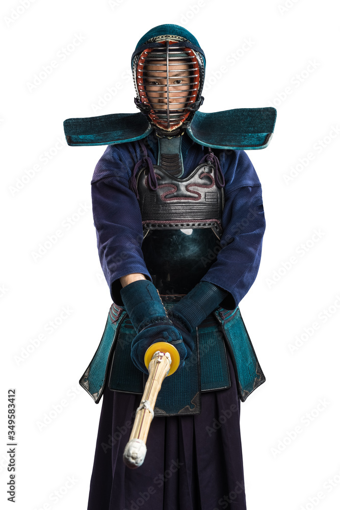 Obraz premium Portrait of man kendo fighter with shinai (bamboo sword). Shot in studio. Isolated with clipping path on white background