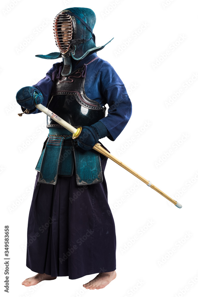 Fototapeta premium Portrait of man kendo fighter with shinai (bamboo sword). Shot in studio. Isolated with clipping path on white background