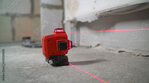 Laser level, construction, finishing work in the room. construction laser Level at work.