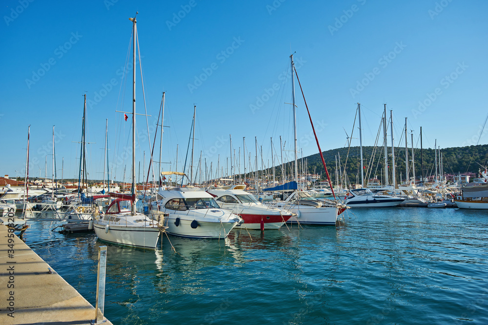 Marina yachts and buildings on background in Cesme