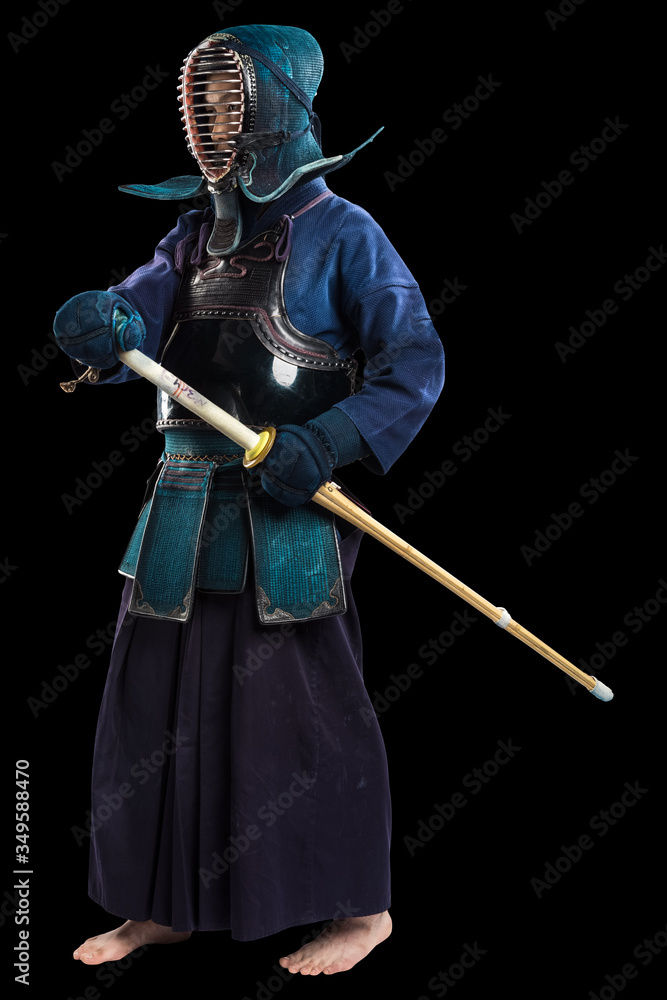 Portrait of man kendo fighter with shinai (bamboo sword). Shot in studio. Isolated with clipping path on black background Portrait of man kendo fighter with shinai (bamboo sword). Shot in studio. Isolated with clipping path on black background