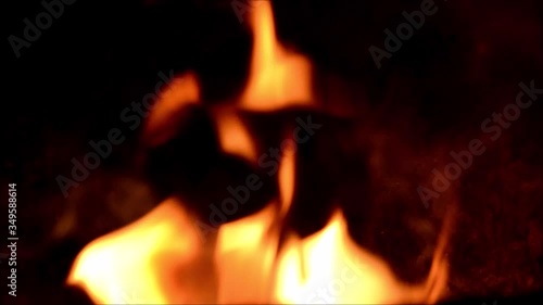 Orange flames of fire on black background