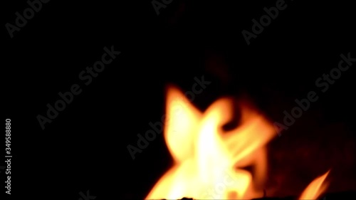 Orange flames of fire on black background