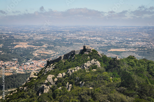 view of the city. Panorama of the castle on the mountain. Rocky Mount covered with green grass