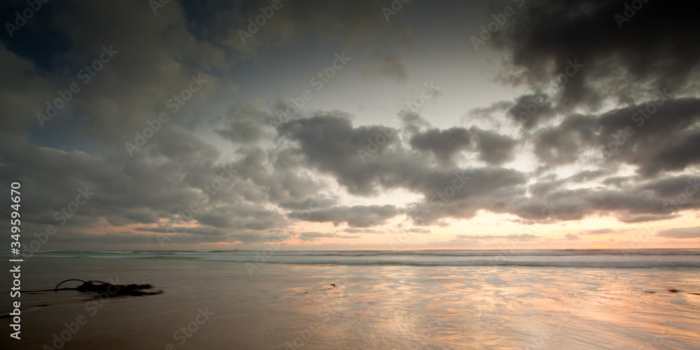 long exposure image of sandy beach and clouds long exposure image of sandy beach and clouds