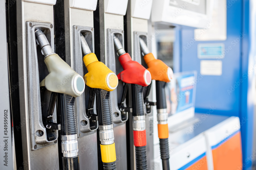refueling pistols in a column at a gas station refueling pistols in a column at a gas station