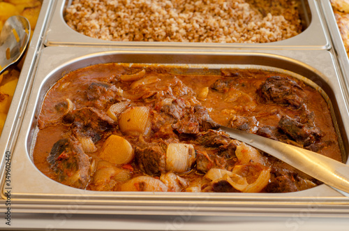 Mediterranean cuisine container with Lamb fricassee. photo