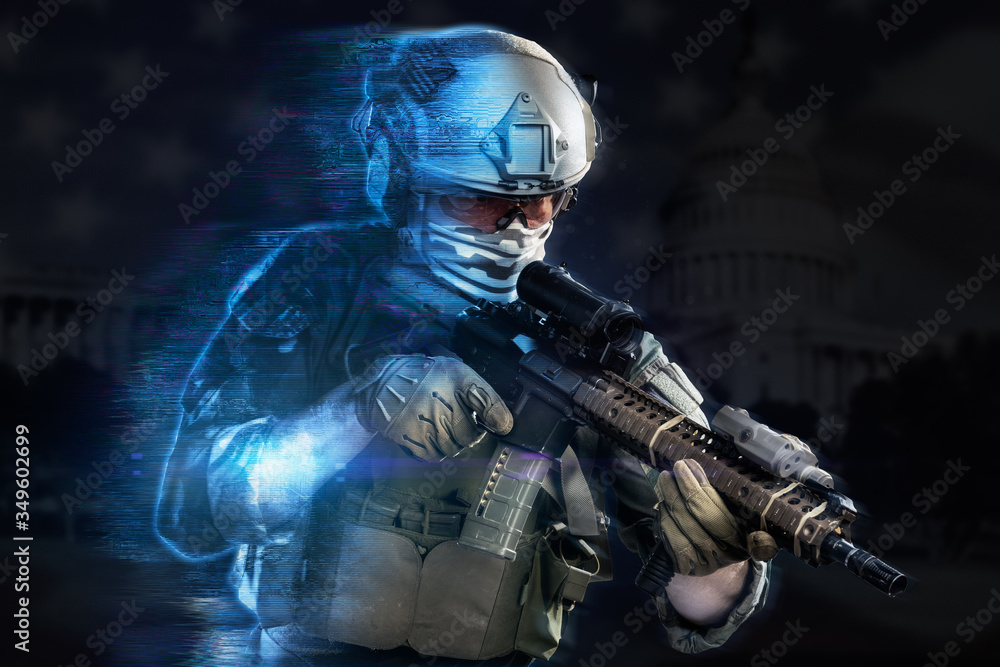 Fototapeta premium Żołnierz korpusu piechoty morskiej USA wychodzący z projekcji holograficznej na czarnym tle. (koncepcja wojskowa technologii przyszłości)