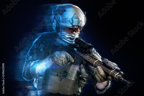 US marine corps soldier coming out from holographic projection on black background. (future technology military concept)