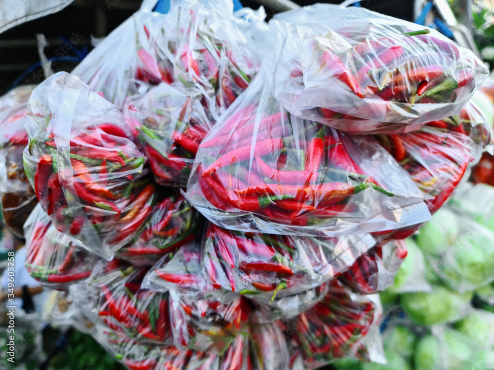 Close-up Fresh Red Hot Chilies in Plastic Bags for Sale