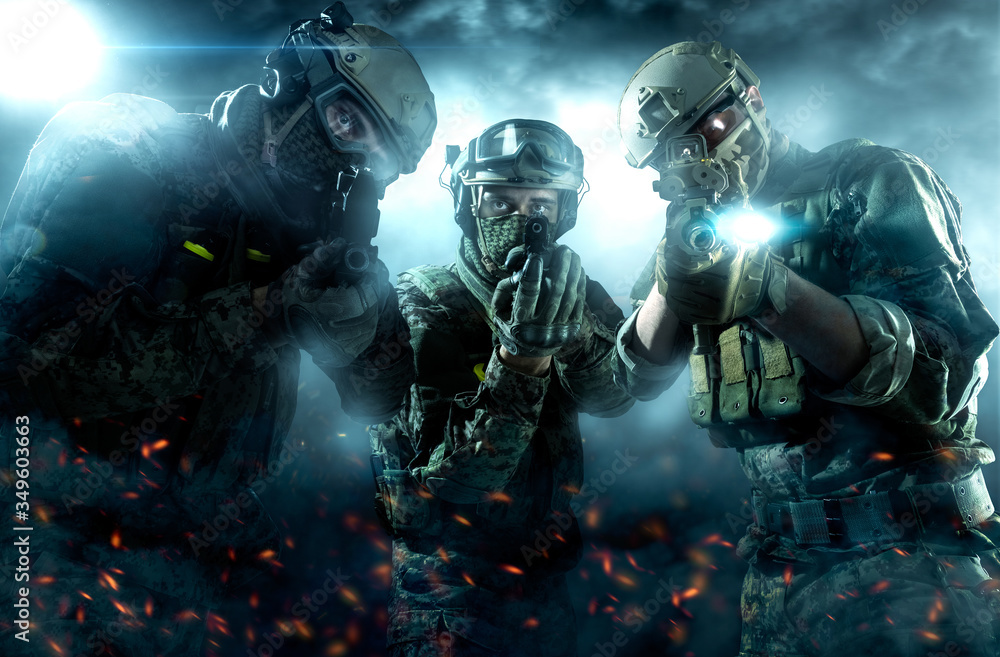 Three males in uniform of Tactical Units of Police with weapons. Shot in studio. flashing lights on background Three males in uniform of Tactical Units of Police with weapons. Shot in studio. flashing lights on background