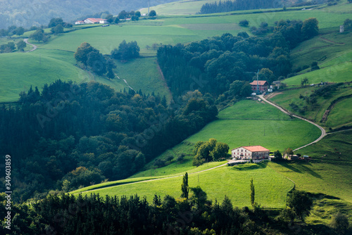 View of the green meadows and Landa Etxeas de Aia