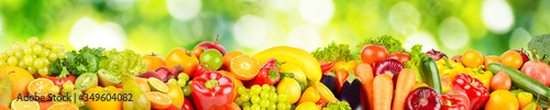 Isolated on green blurred background fruits and vegetables.