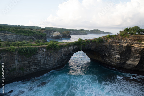 destroyed rocks and a Bay with an arch on an island in the Indian ocean a broken beach