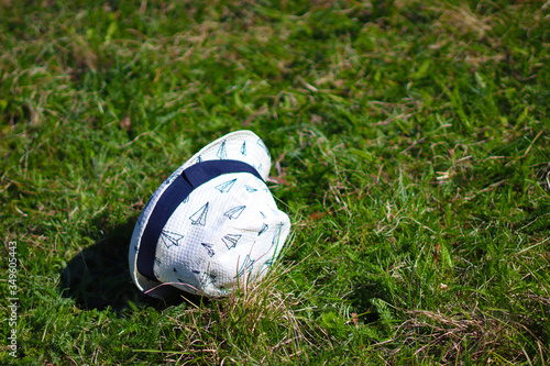 White hat on green grass
