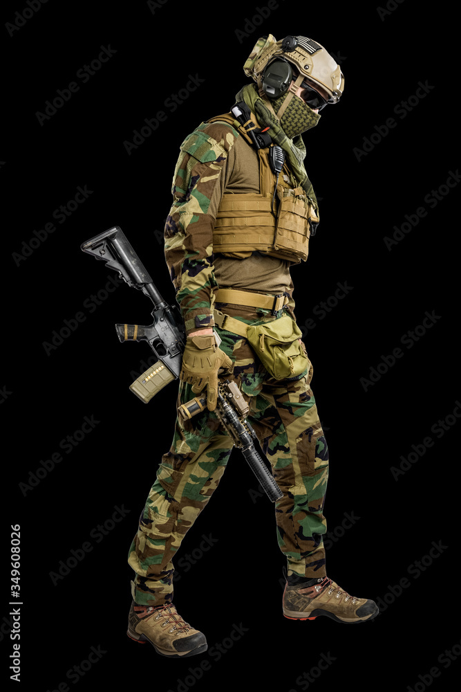 US marine corps soldier with rifle. Shot in studio. isolated with clipping on black background. US marine corps soldier with rifle. Shot in studio. isolated with clipping on black background.