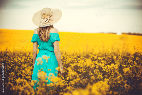 Young woman standingon the rape with sunrise on the background photo