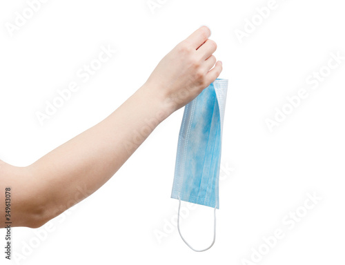 Woman hand holding disposal nonwoven safety mask.