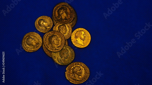Ancient Rome gold and silver coins on blue background