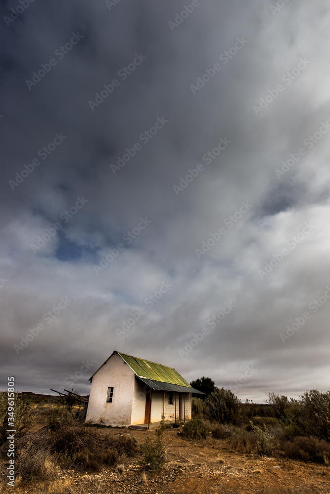 abandoned house in the Karoo with stormy clouds abandoned house in the Karoo with stormy clouds