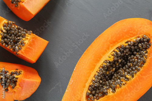 papaya pieces on a grey background