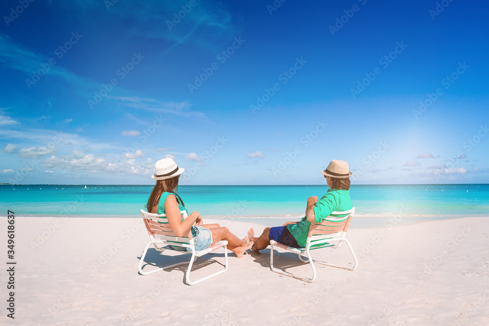 Young couple on white beach during summer vacation. Young couple on white beach during summer vacation.