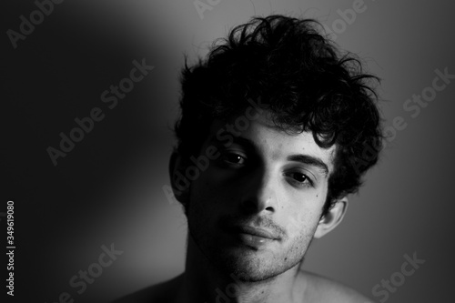 Black and white Man looking camera curly hair cute affraid