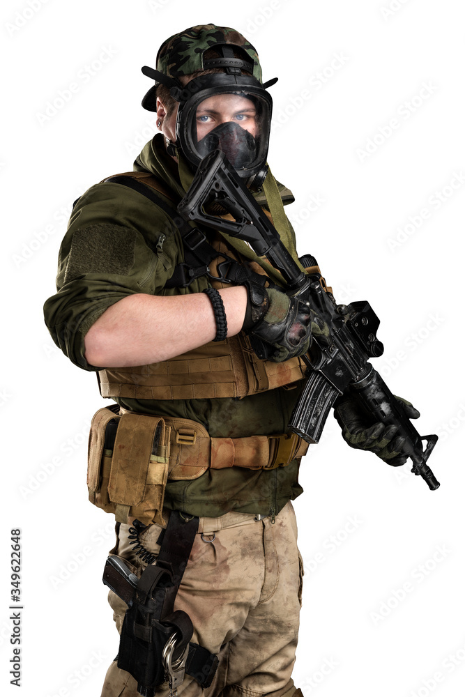 Police officer in gas mask with assault rifle. Uniform conforms to elite task force of the United States. Shot in studio.
