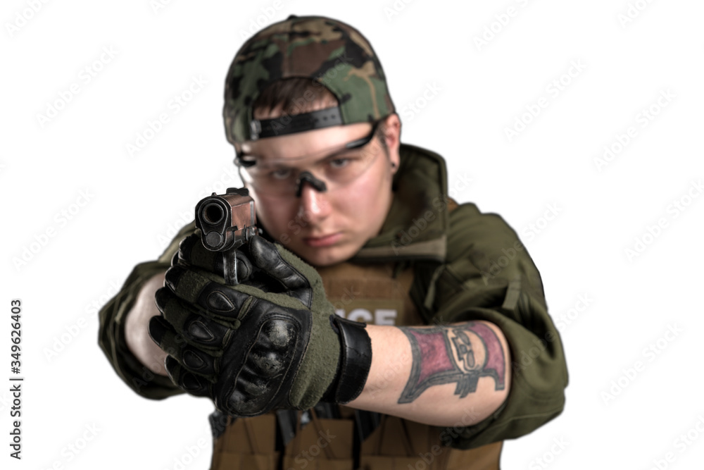 Police officer in gas mask with assault rifle. Uniform conforms to elite task force of the United States. Shot in studio.
Police officer in gas mask with assault rifle. Uniform conforms to elite task force of the United States. Shot in studio.