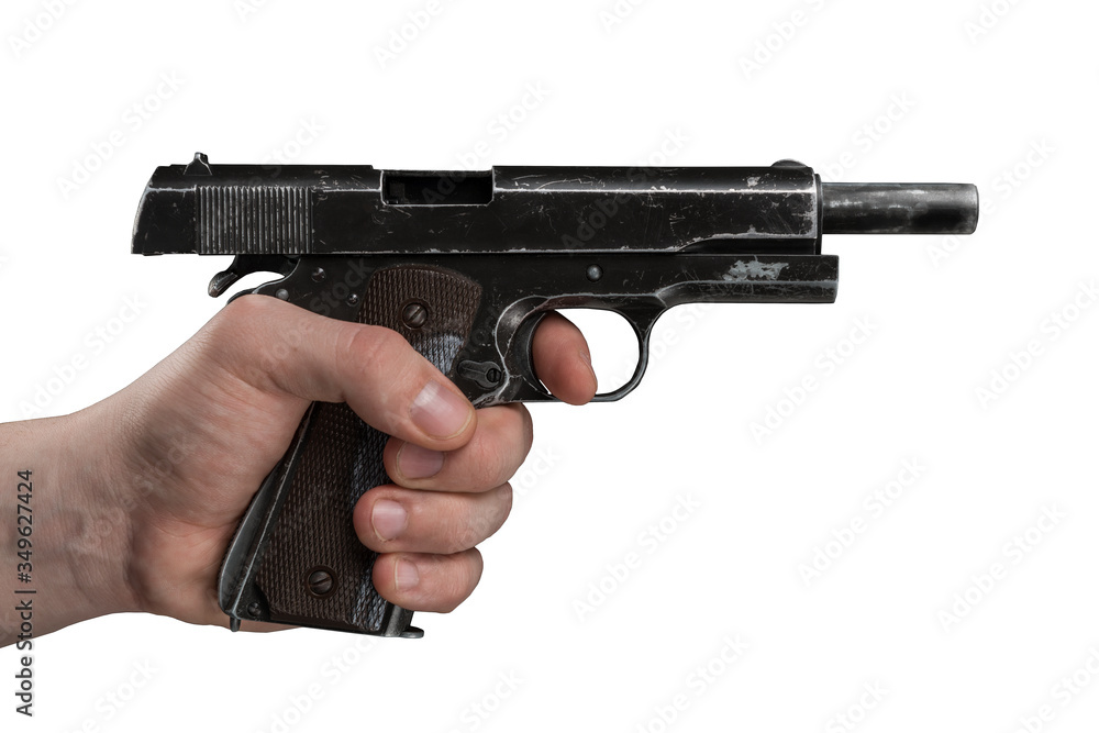 Legendary U.S. Army handgun Colt 1911A1 in male hand isolated on white background. Military model pistol from World War Two. (gray color).
Legendary U.S. Army handgun Colt 1911A1 in male hand isolated on white background. Military model pistol from World War Two. (gray color).