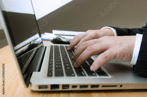 Businessman using laptop to the situation on the market value , Business concept.