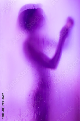 silhouette of a woman taking a shower