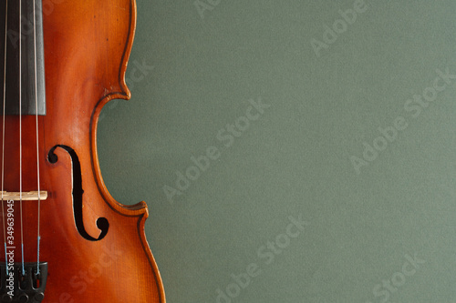 Fotobehang Classical music concert poster with brown color violin on dark green background