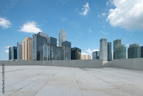 empty square floor and modern office buildings in downtown with skyline 