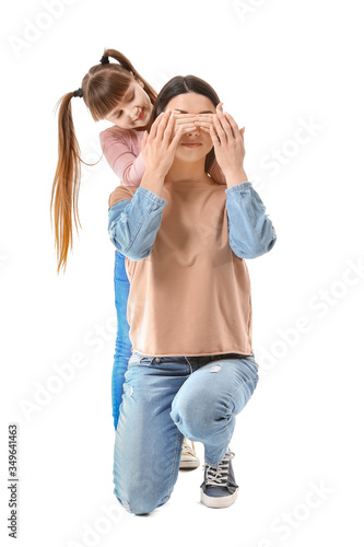 Playful daughter covering m...