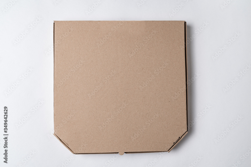 Cardboard pizza box on white background. Mockup, place for text. Cardboard pizza box on white background. Mockup, place for text.