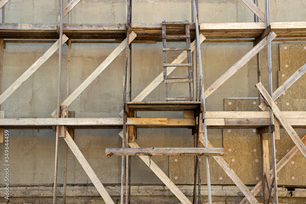 wooden scaffolding during the construction of a large house or cottage outside