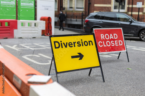 Photography Yellow Road Sign with Arrow: Diversion Text and Barrier