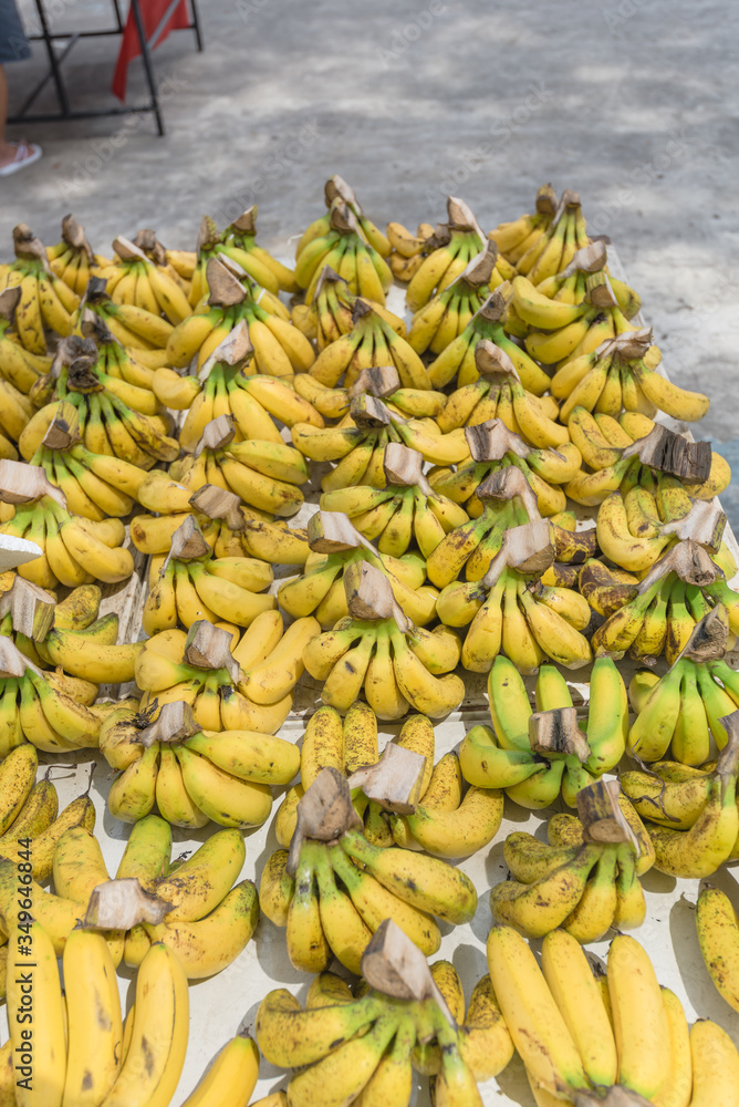 Large quantity of banana bunches at fruit stand in Geylang, Singapore