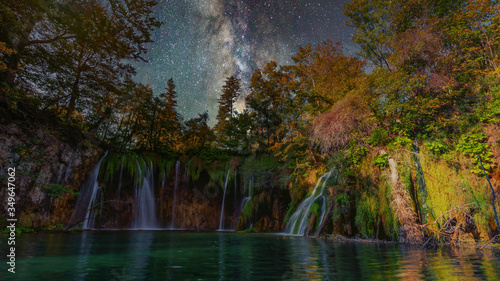 Wonderful night with milky way up the pure water waterfall on Plitvice National Park. Colorful spring panorama of green forest with blue lake. Great countryside view of Croatia  Europe. Travel concept